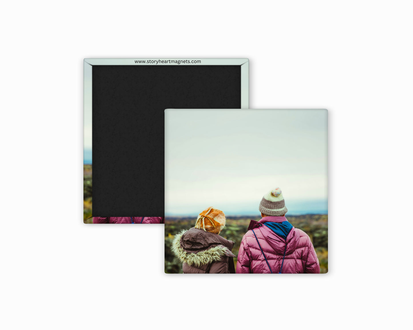 couple facing out toward mountain skyline on a 2.5 square in magnet